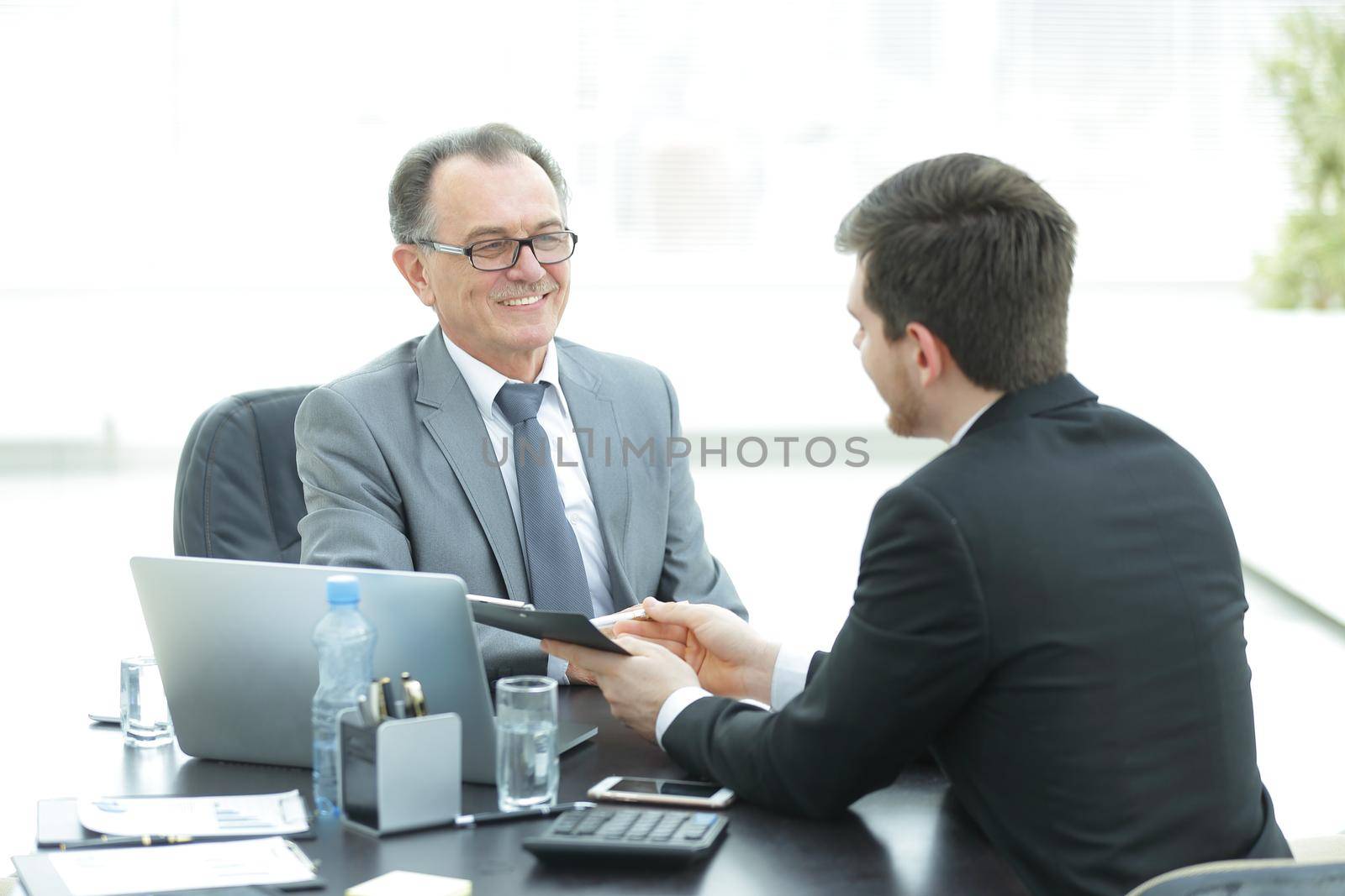 close up.business people talking at a Desk.meetings and partnership