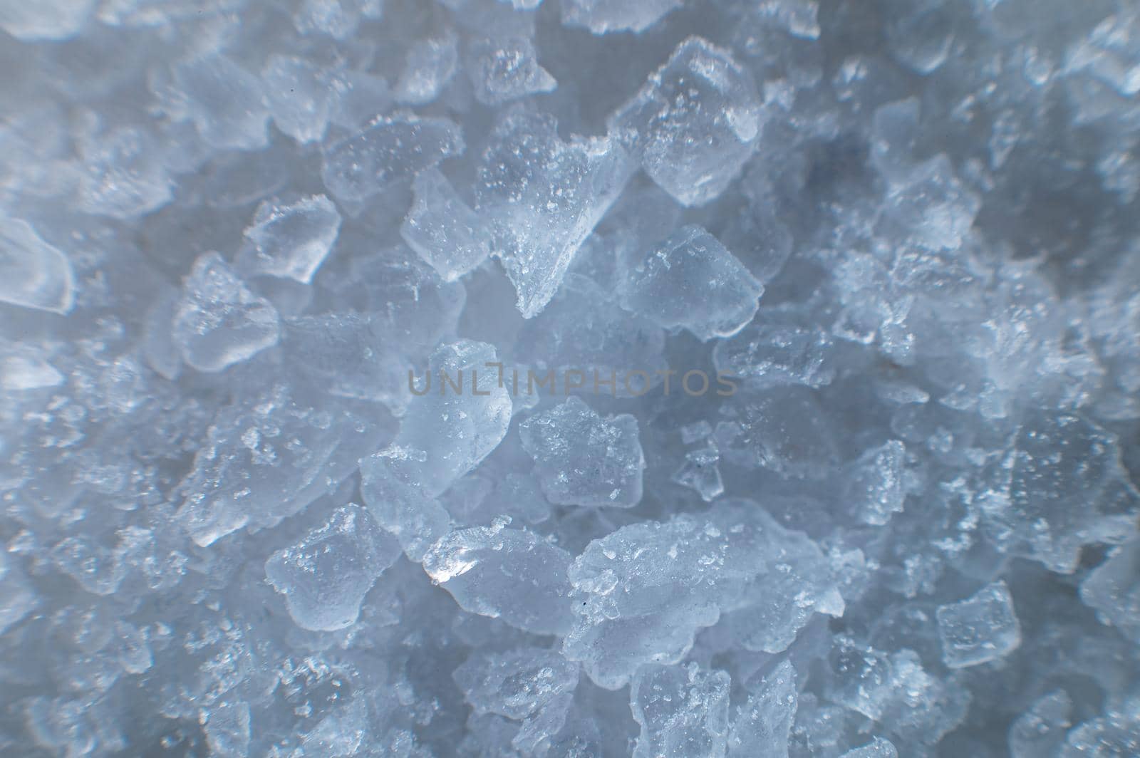 Coarse white iodized salt. Detailed background texture Macro close-up. Salt crystals of different sizes by yanik88