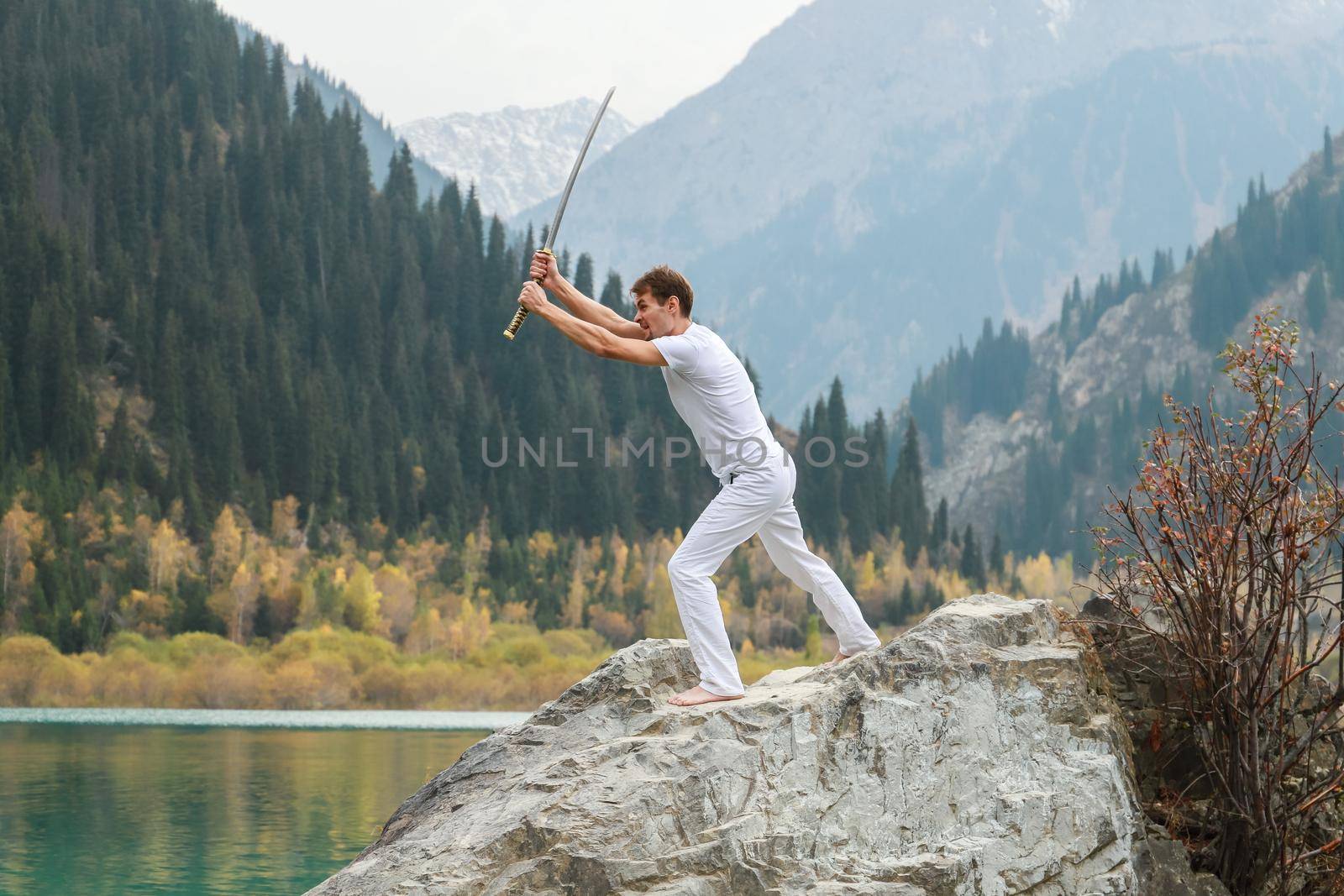 A man with a sword goes on the attack on the enemy. The emotional struggle of man.