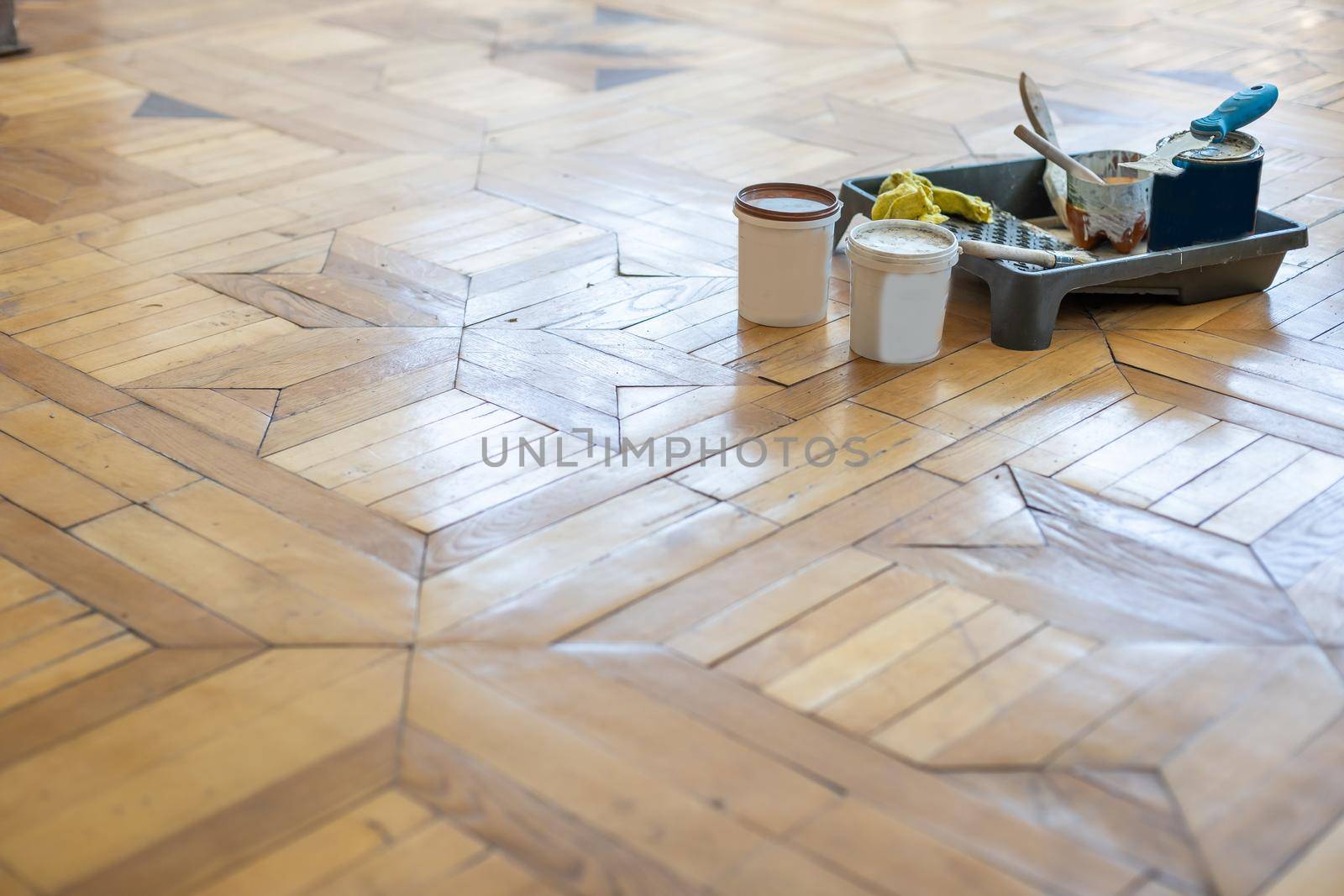 Renovated brown oak parquet, Reconstruction old house symbol, Wooden oak parquet floor background. by Andelov13