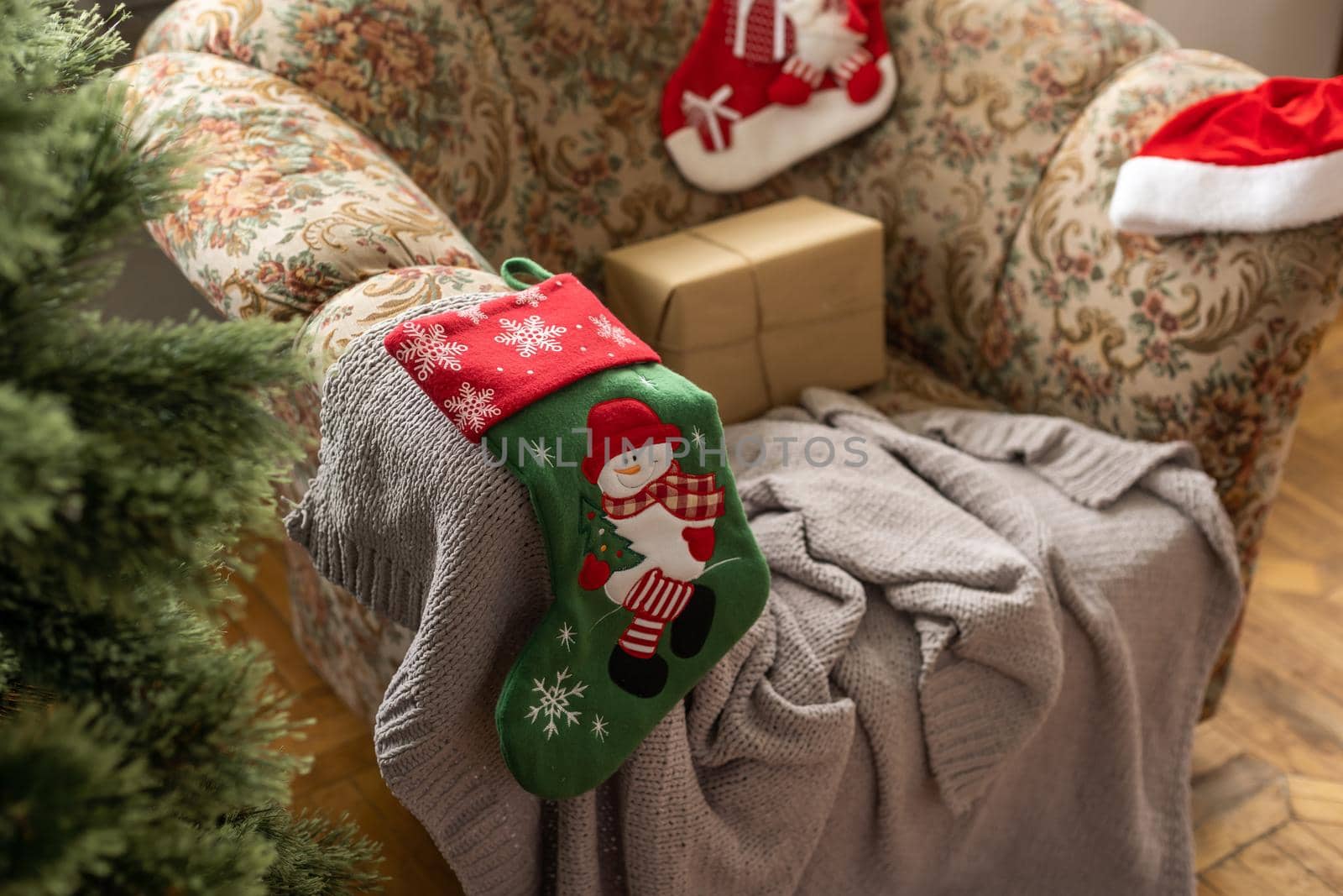 Christmas Eve. red color decorated sock hanging on christmas tree with bokeh light background, holiday family, happy new year and merry christmas festival concept, vintage color tone effect.