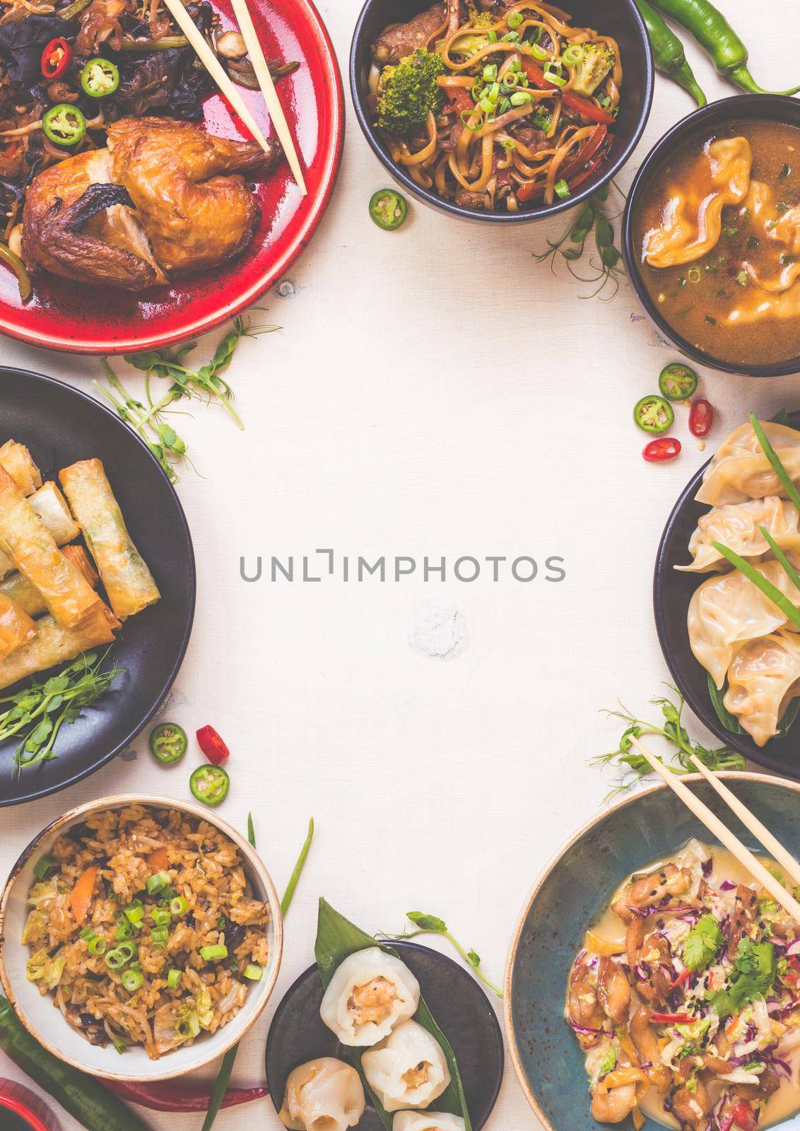 Chinese food white background. Chinese noodles, fried rice, dumplings, peking duck, dim sum, spring rolls. Famous Chinese cuisine dishes set. Space for text. Top view. Toned image