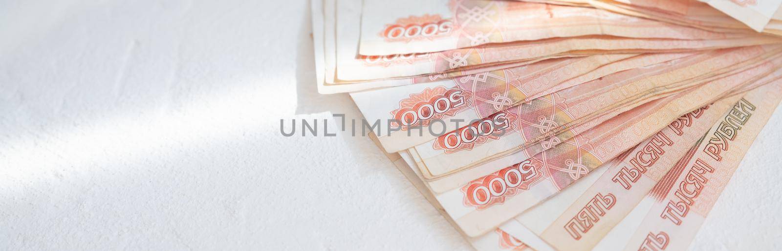 Russian ruble banknotes issued by the Bank of Russia. Financial system and economy of Russia. World monetary system.