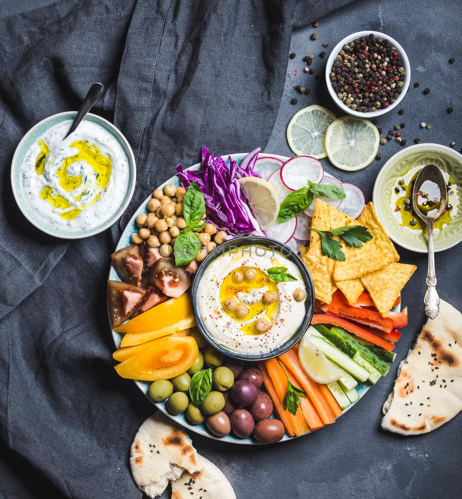 Hummus platter with assorted snacks by its_al_dente