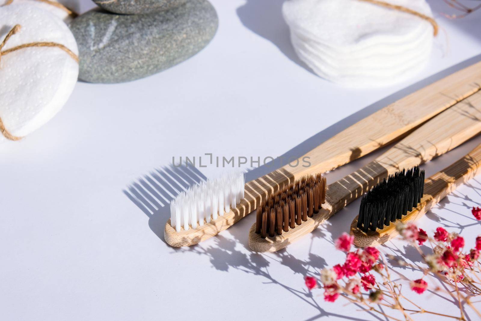 Bamboo toothbrush Bio organic cotton reusable round pads for make up removal. Biodegradable, organic trendy shadows. Eco friendly life style concept, zero waste. Eco bathroom without plastic. Copy space