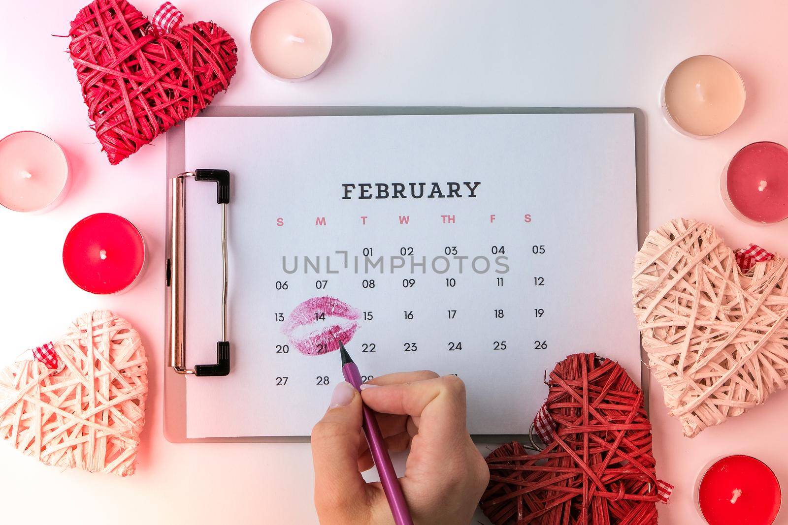 Calendar with 14th of February date. Planning Valentines day holiday. Love romantic dating. Preparing with hearts. by anna_stasiia