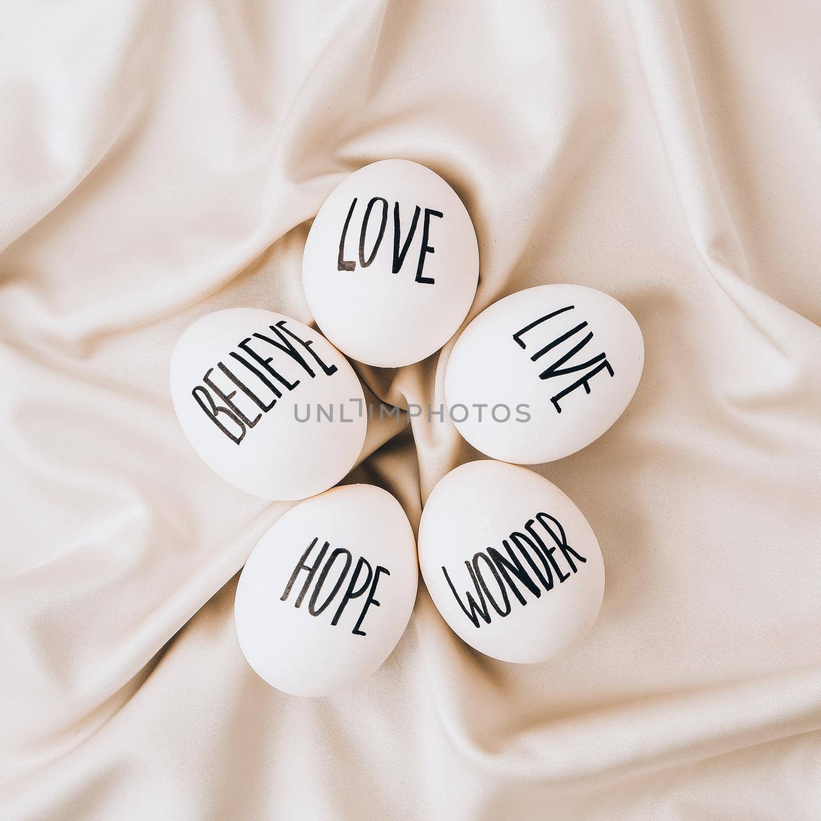 Easter eggs Composition. Egg name settings and happy easter message, drawn with pen. High Angle View Of Shells On Table. Love Live Believe Wonder Hope by anna_stasiia