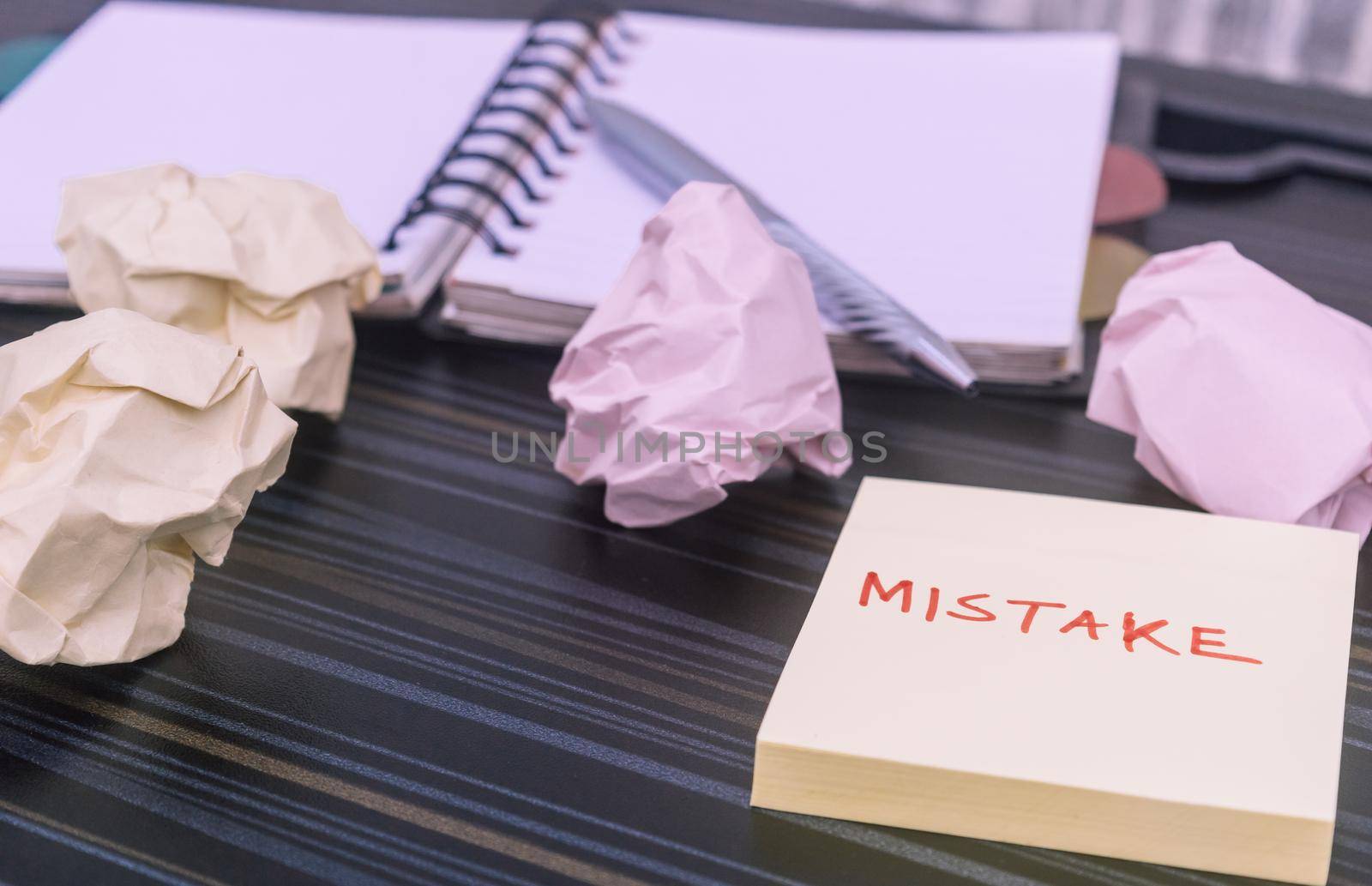 Mistake written on sticky notes. Learning, wrong, blooper, error message, regret sayings background. Fault, defect, careless, lesson correction and reconciliation concept for business finance industry by sudiptabhowmick