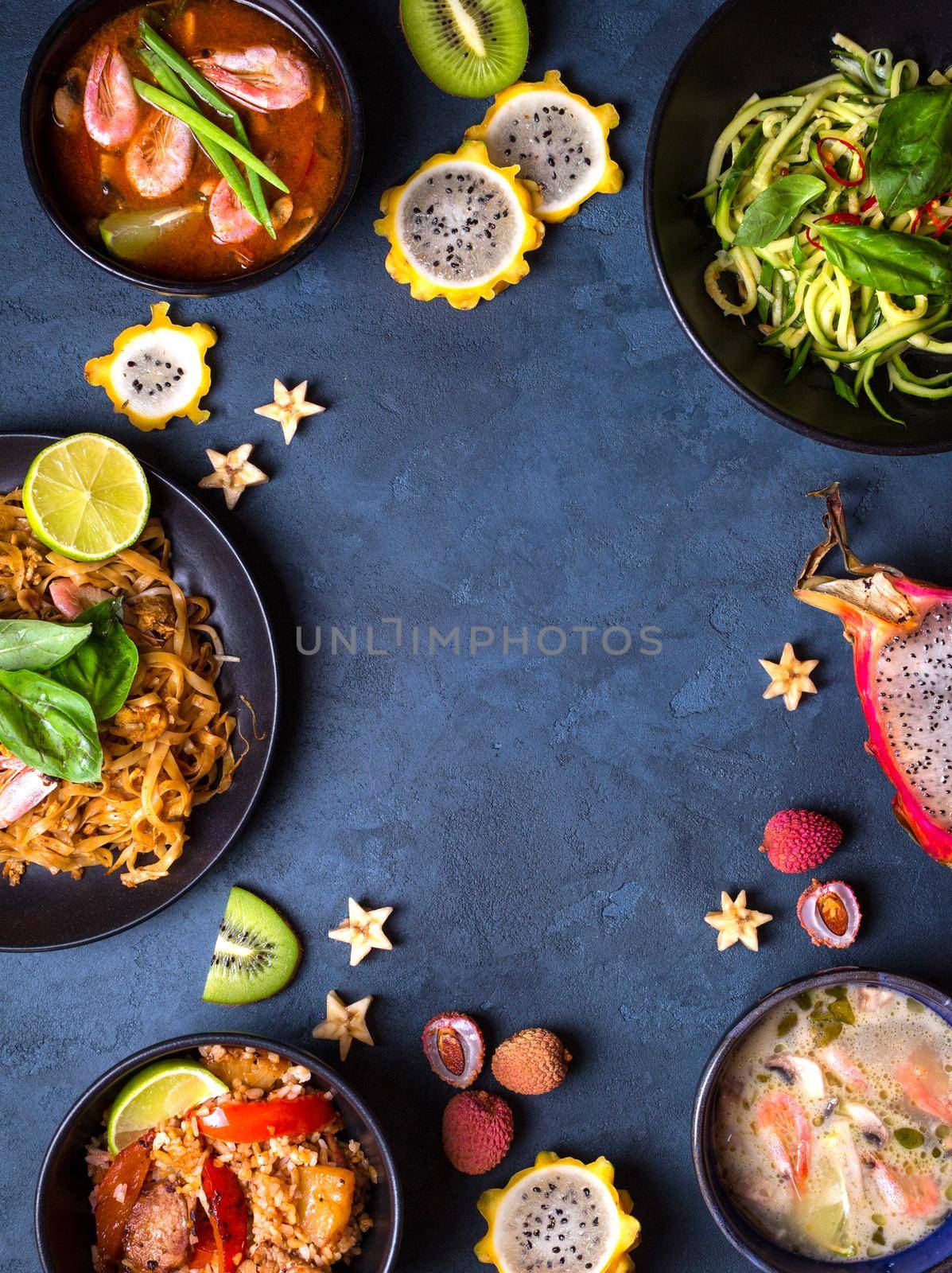 Thai food background. Dishes of thai cuisine. Tom yum, tom kha gai, pad thai noodles, thai fried rice with pork and vegetables khao phat mu, green papaya salad som tam, thai fruits. Space for text