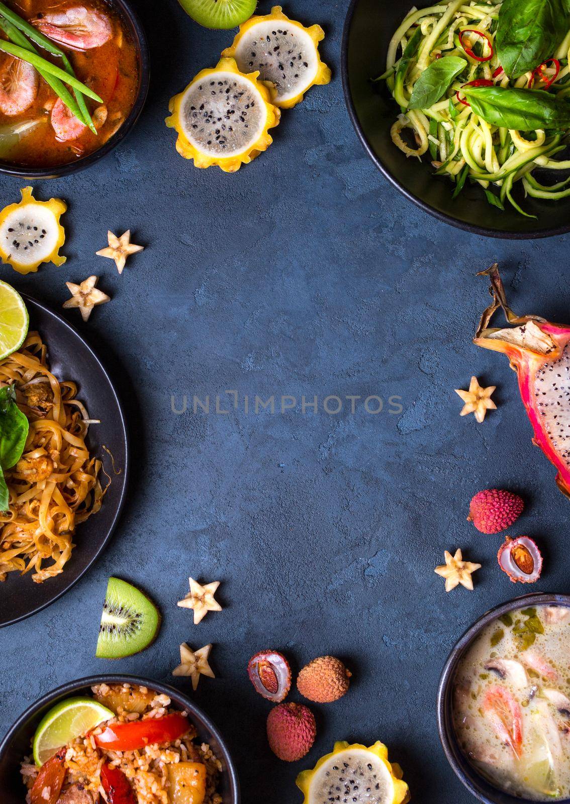 Thai food background. Dishes of thai cuisine. Tom yum, tom kha gai, pad thai noodles, thai fried rice with pork and vegetables khao phat mu, green papaya salad som tam, thai fruits. Space for text