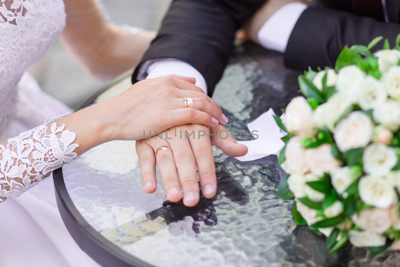 Close-up of wedding hands with rings by BY-_-BY