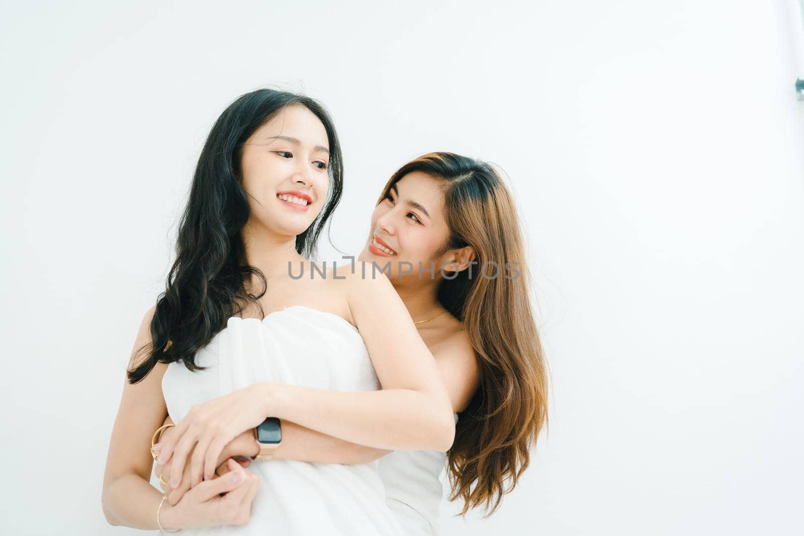 lgbtq, LGBT concept, homosexuality, portrait of two Asian women posing happy together and showing love for each other while taking a shower.