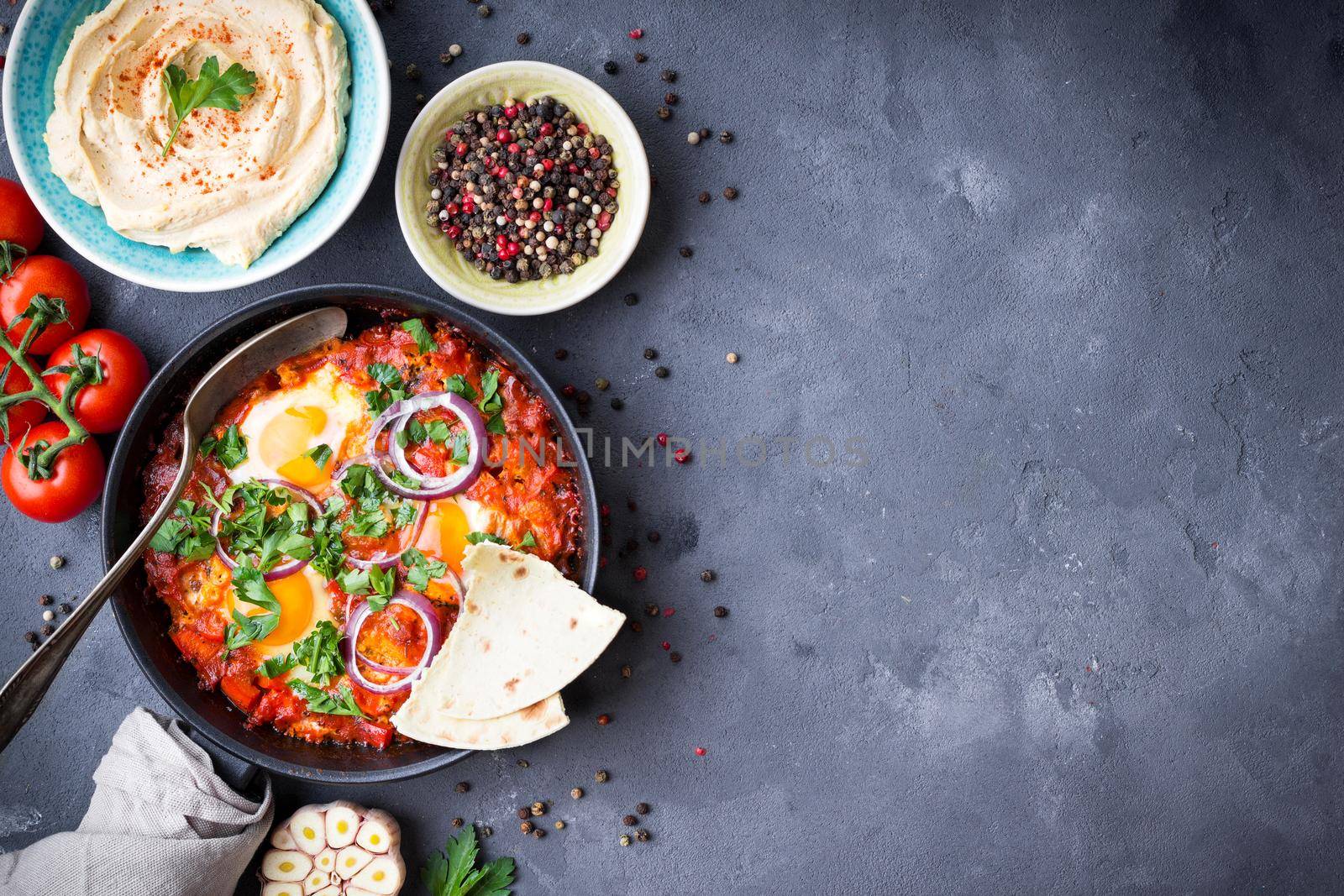 Shakshuka with pita bread and hummus by its_al_dente