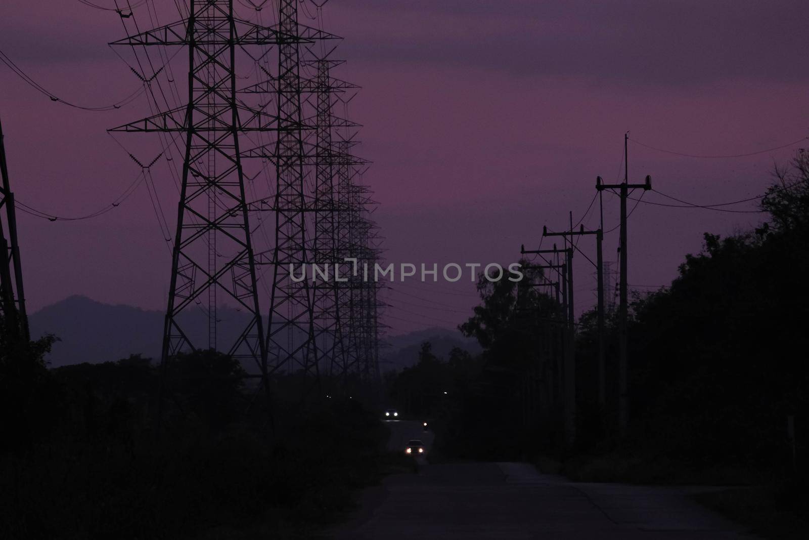 High voltage pole. High voltage tower on sunset sky background.
