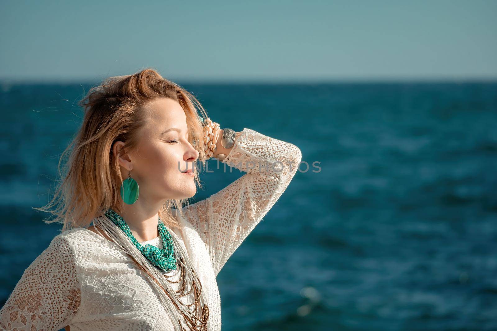 fashionable young model in boho style dress