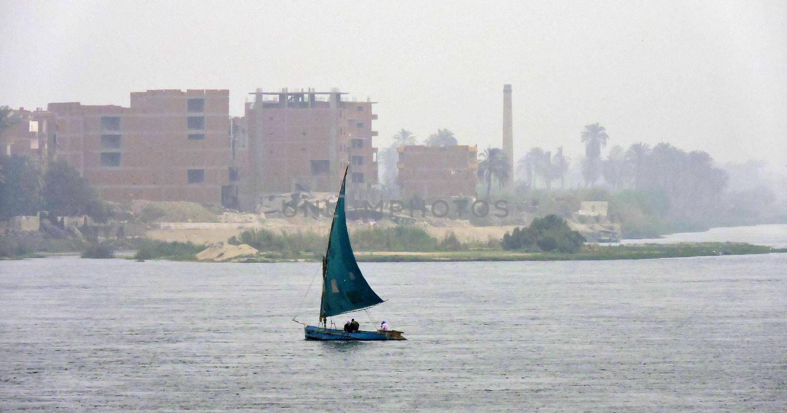 A blue sailing ship on the Nile, Egypt by WielandTeixeira