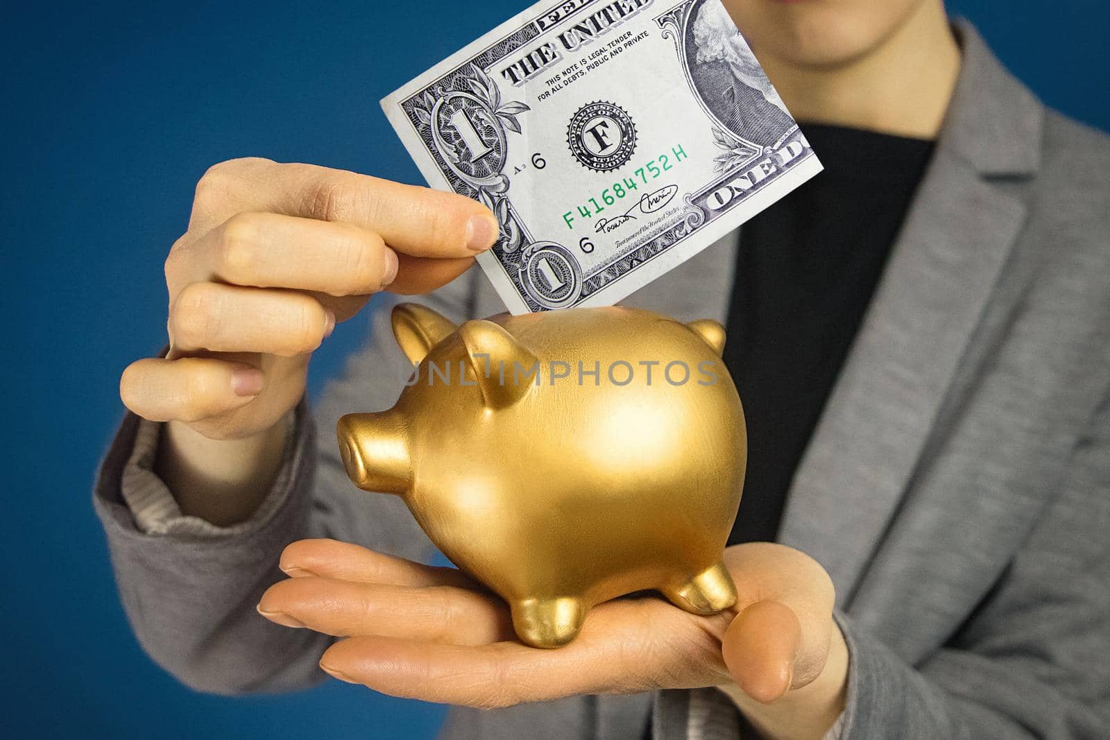Close-up woman hands with american dollar and money box.