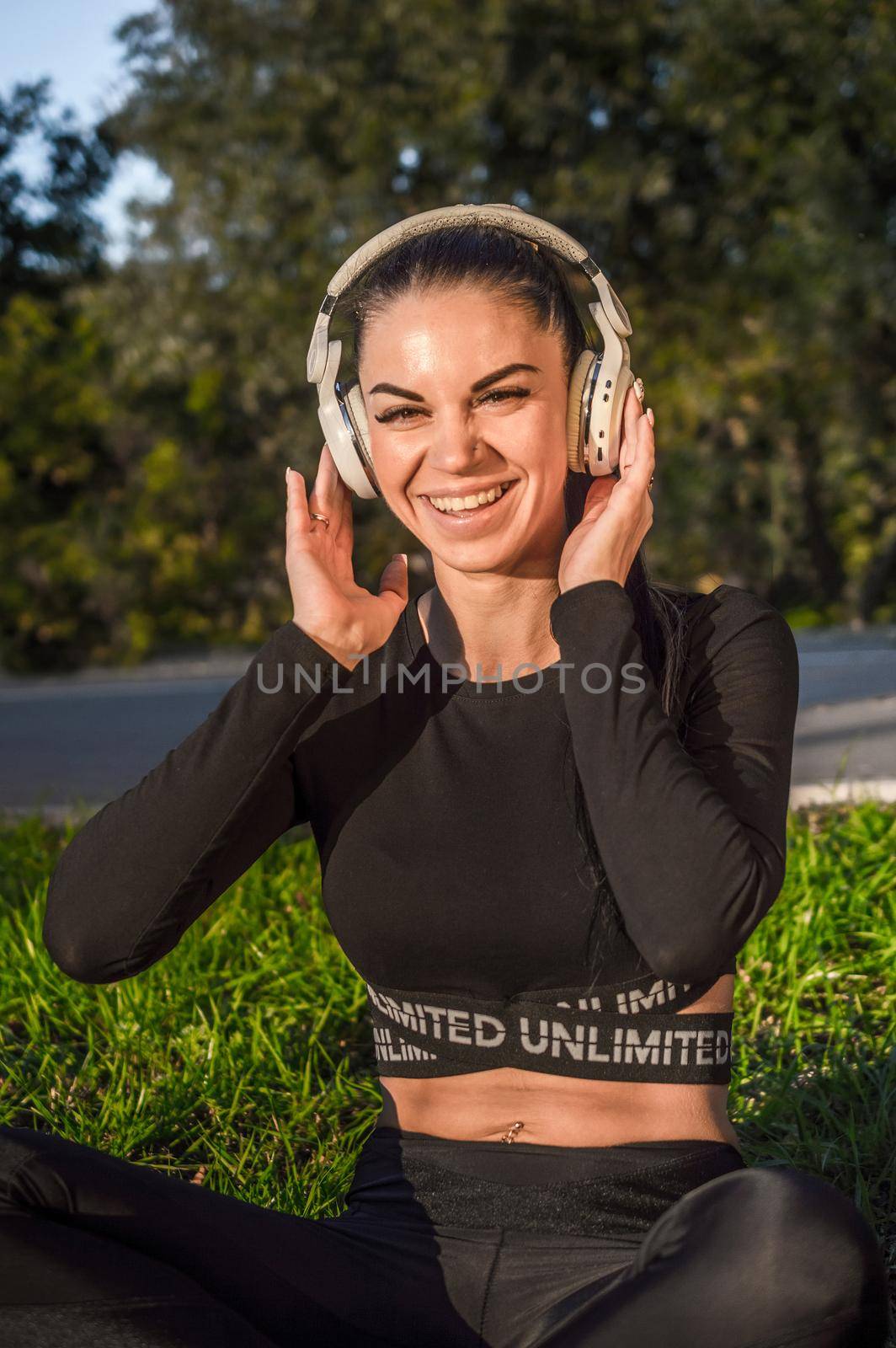 Cute girl listening to the music with headphones./Beautiful woman enjoys listening to music.