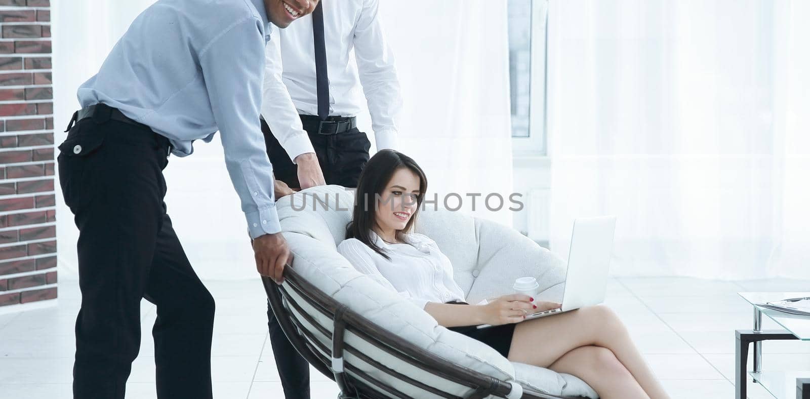 business woman with colleagues discussing work issues,sitting in a comfortable chair