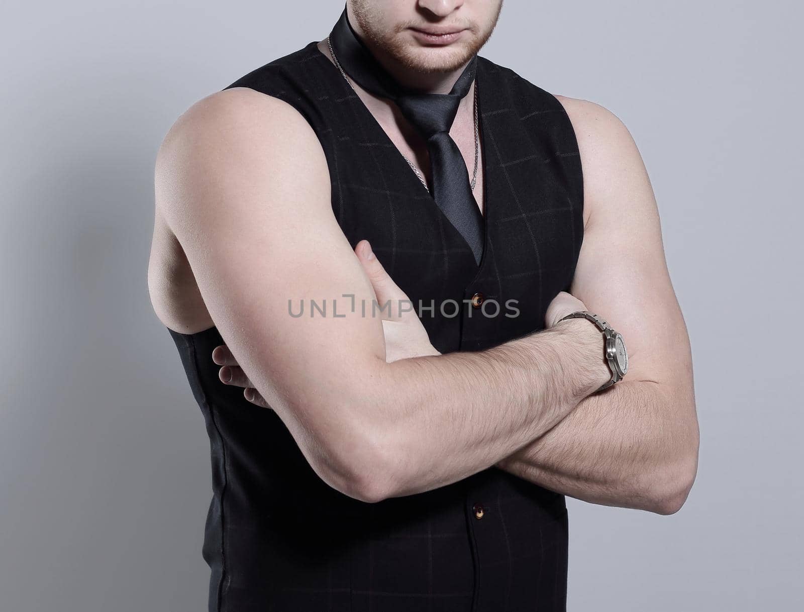 young businessman in a tie without a shirt by SmartPhotoLab