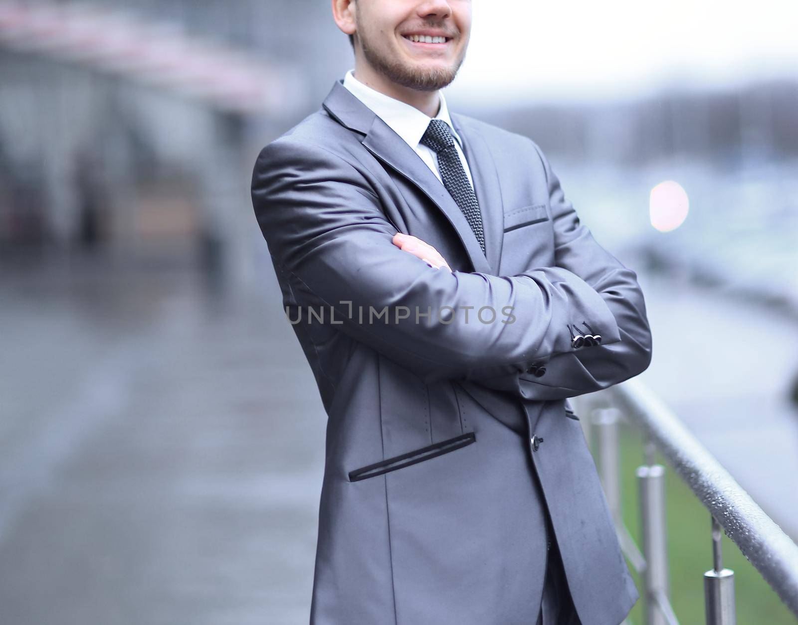 young businessman standing near the office building.photo with copy space