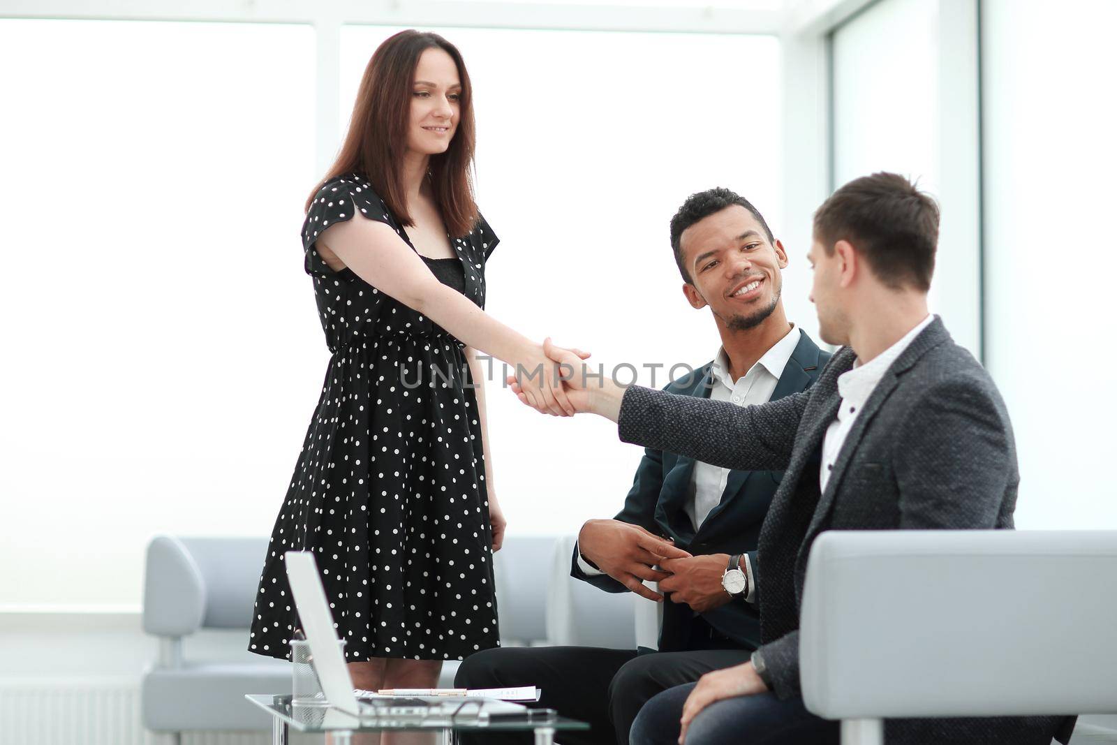young business partners shaking hands before starting a business meeting. concept of cooperation