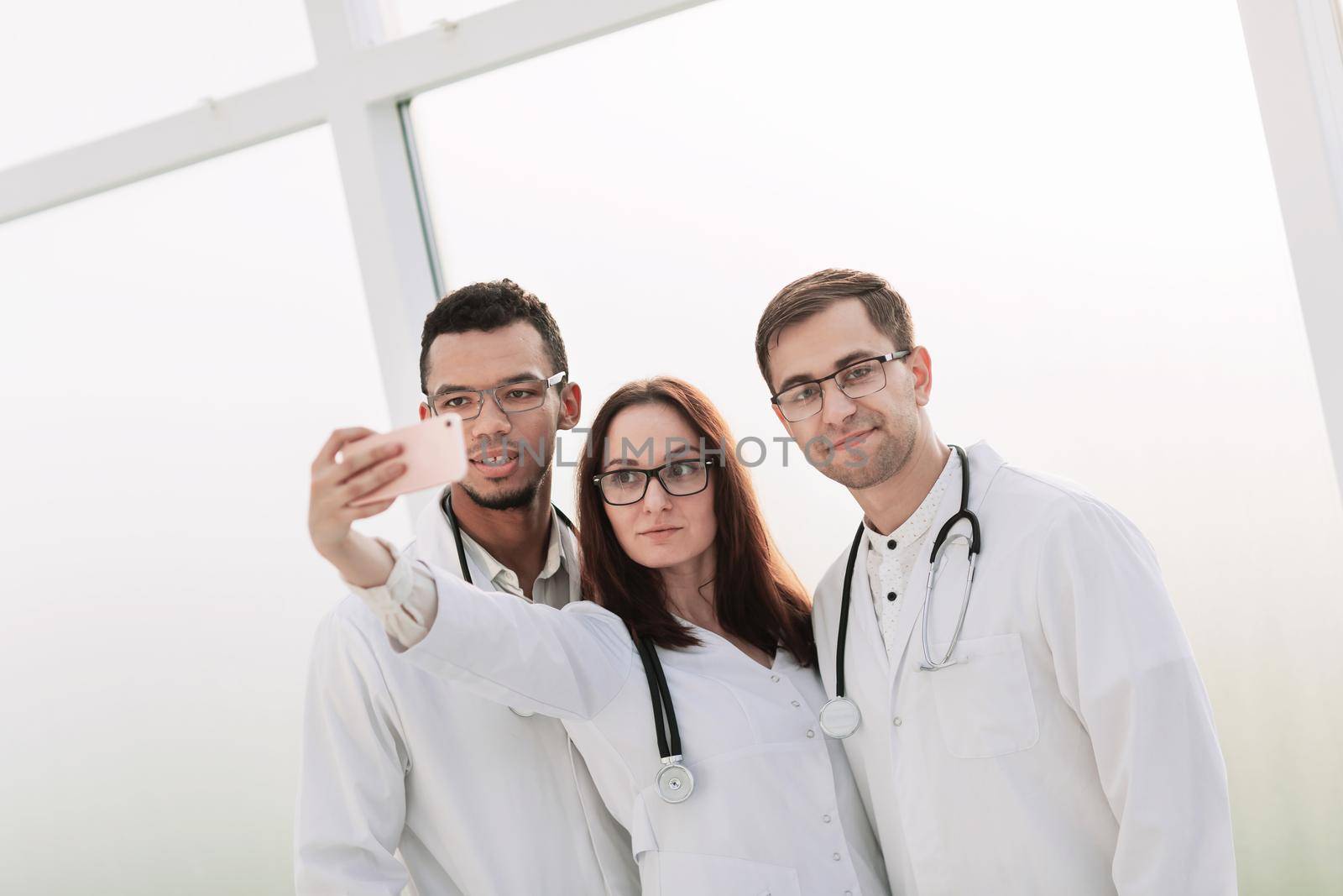 close up.group of medical doctors taking selfies. people and technology