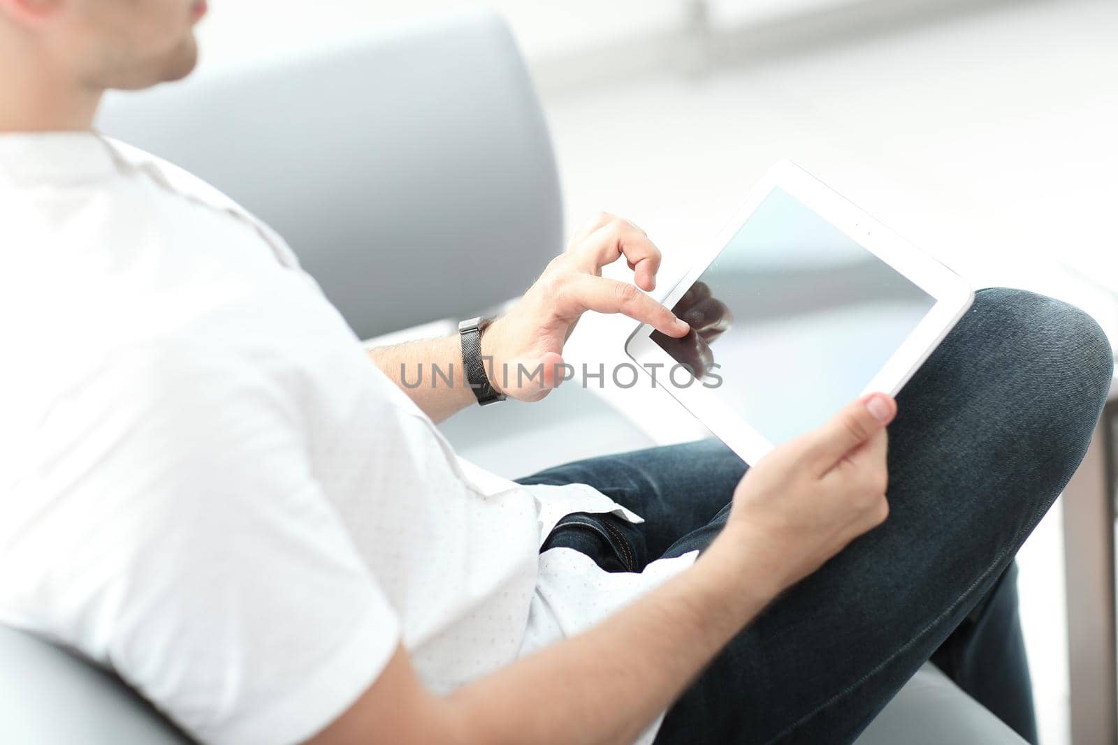 close up.a modern man with a digital tablet . people and technology