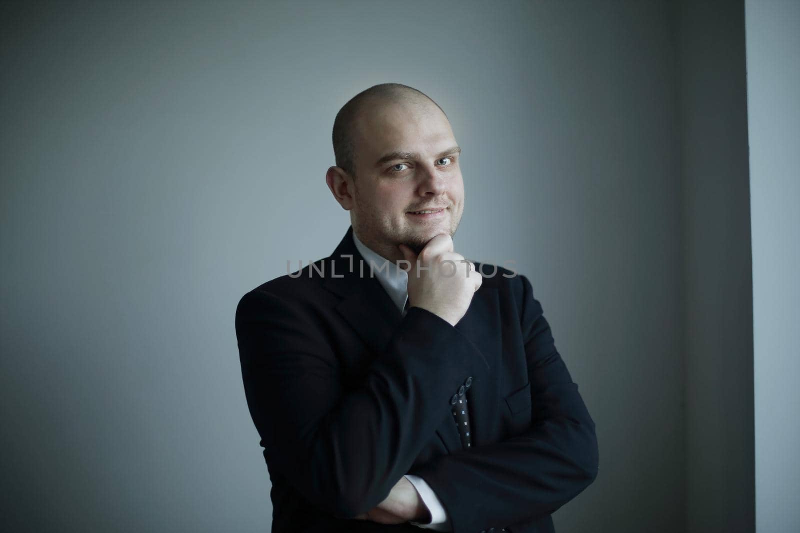 close up. thoughtful businessman looking at copy space.isolated on grey background