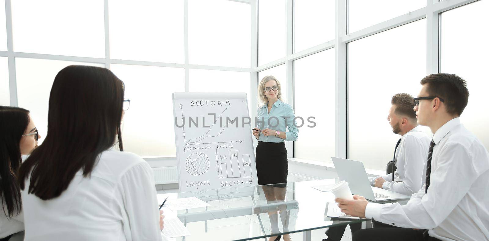 businesswoman holds a meeting with the business team. by SmartPhotoLab