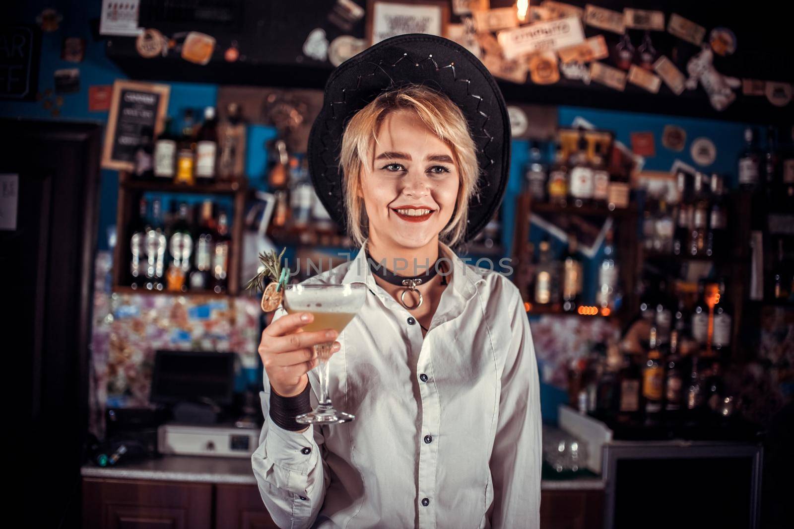Girl barman mixes a cocktail at the porterhouse