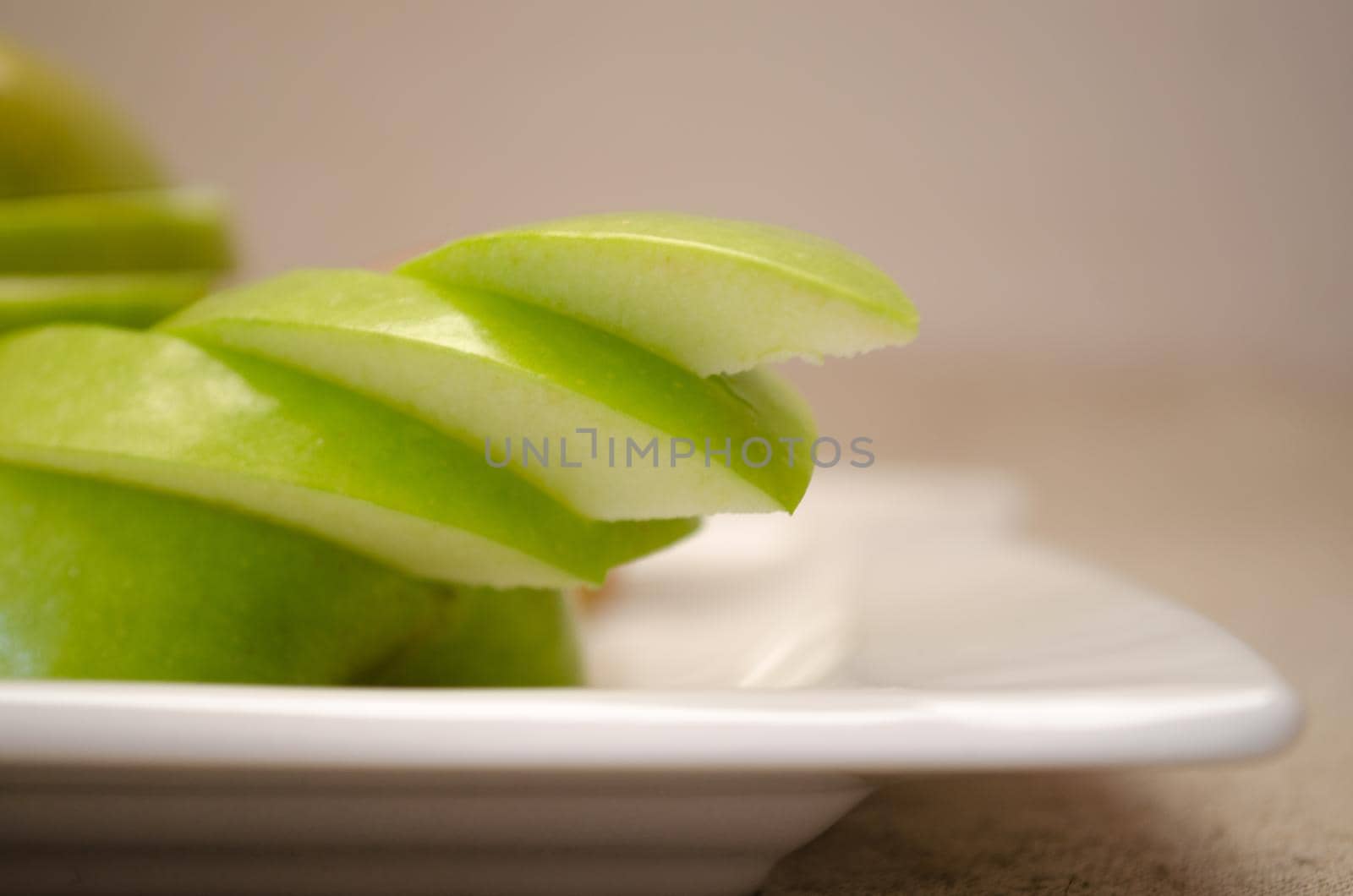 Green sliced apples by Proff