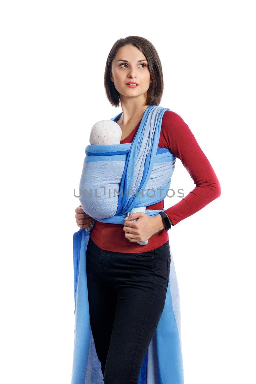 Babywearing attractive young mother with baby in blue woven wrap carrier. Free hands and active motherhood concept idea by Rom4ek