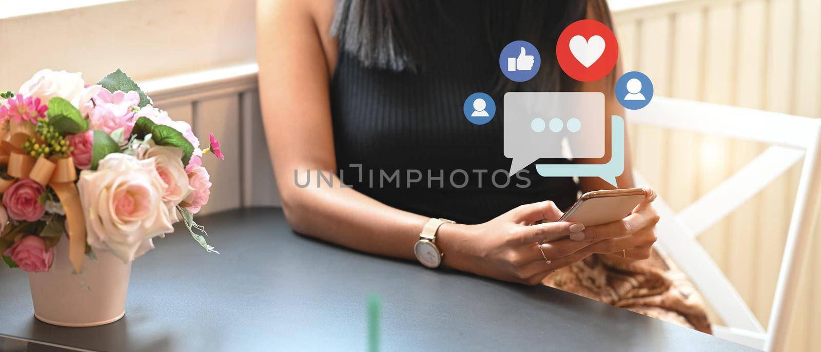 Stylish young woman using a smartphone with social media icon. Social media and digital online concept. by prathanchorruangsak