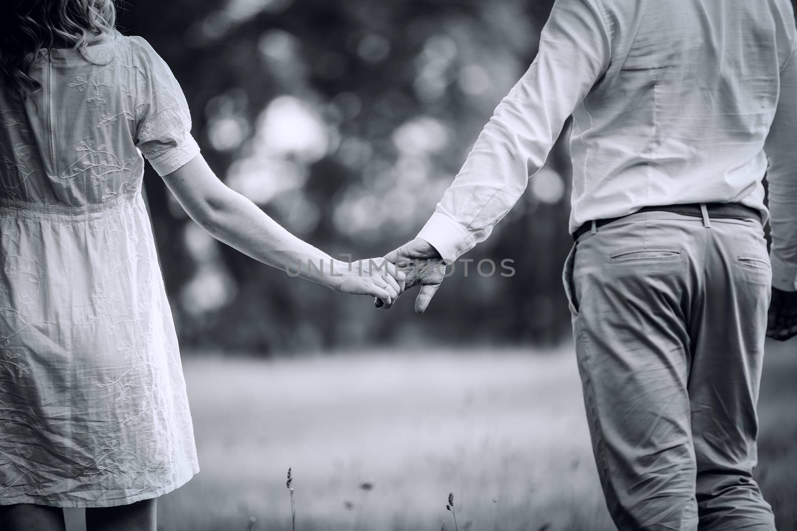 photo in retro style. young family walking on the grass in the Park by SmartPhotoLab