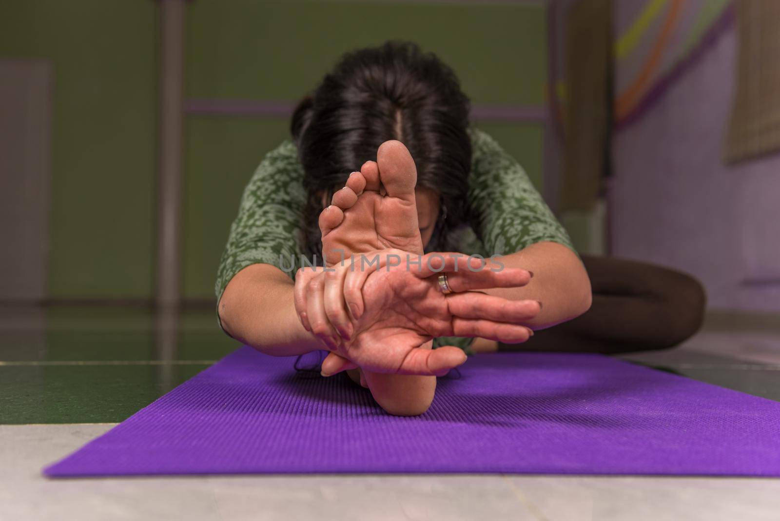 Yogi poses in the gym./Yoga master performing yoga poses .