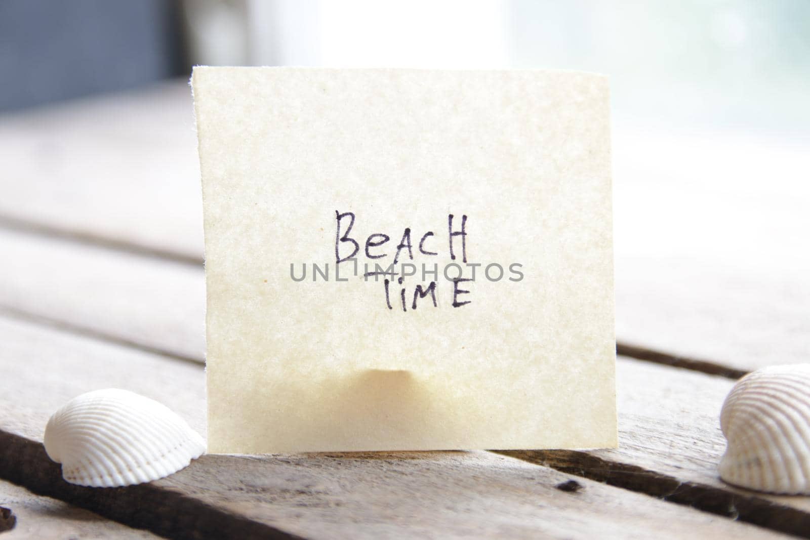 Beach time concept. Paper card with an inscription. by Markgraf