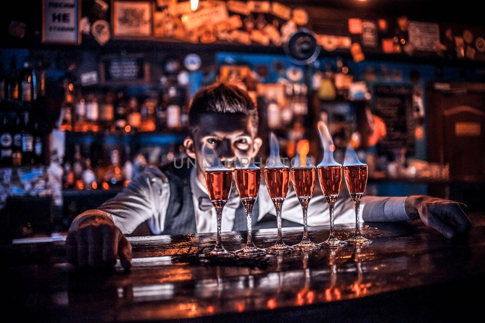 Barman makes a cocktail at the saloon