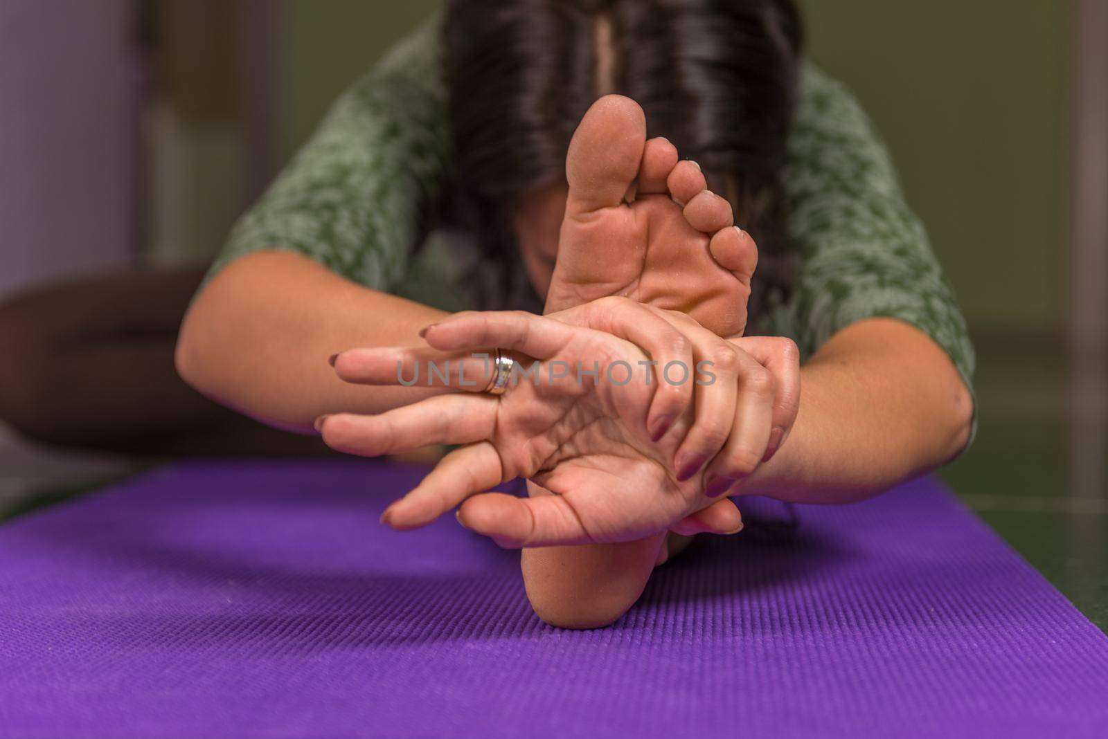 Yoga trainer works out yoga stretches in the gym./Professional yoga trainer poses yoga positions in a studio.