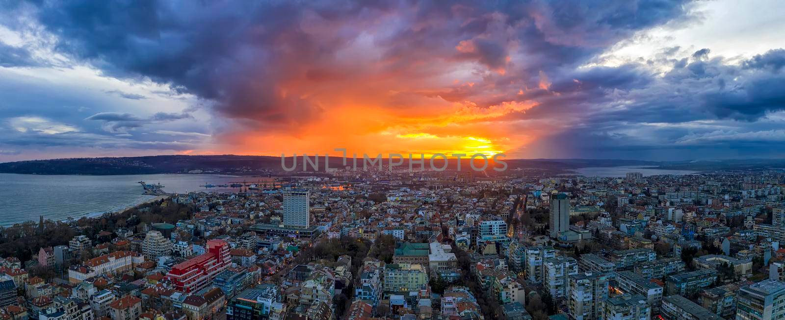 Amazing colorful sunset over the city. aerial panoramic view from drone, Varna city, Bulgaria  by EdVal