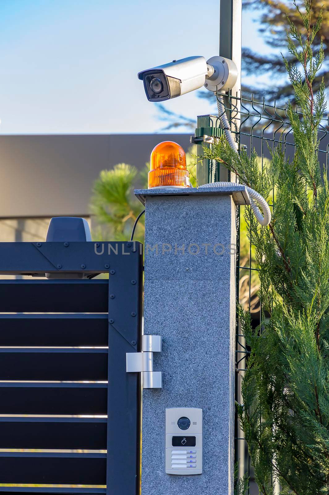 Security equipment - lamp, camera and video intercom, in the entry of a house. Technology and security 