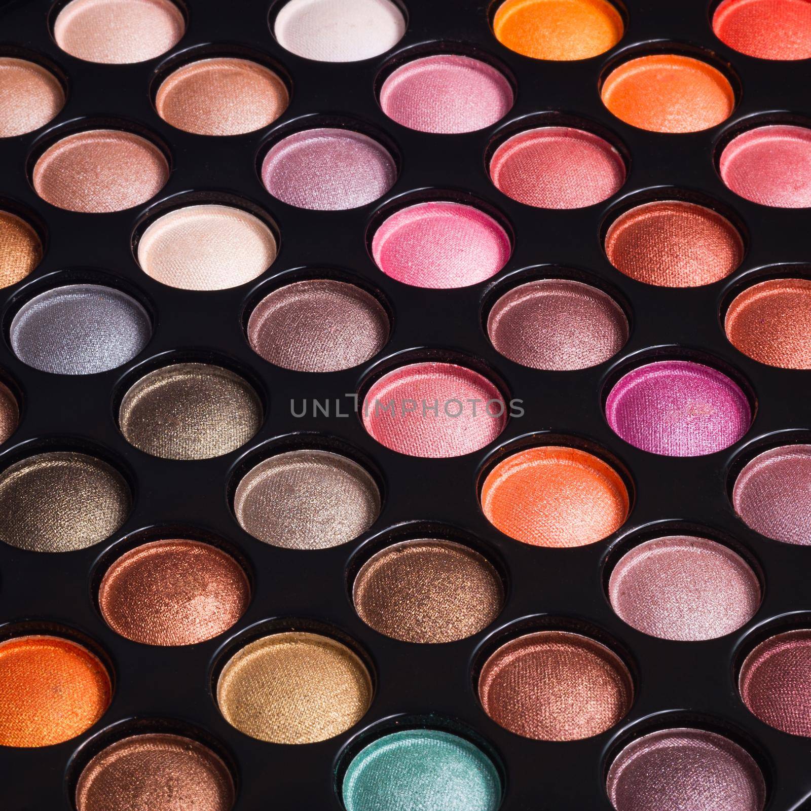 Closeup of make-up eye shadows. Makeup palette. Make-up background