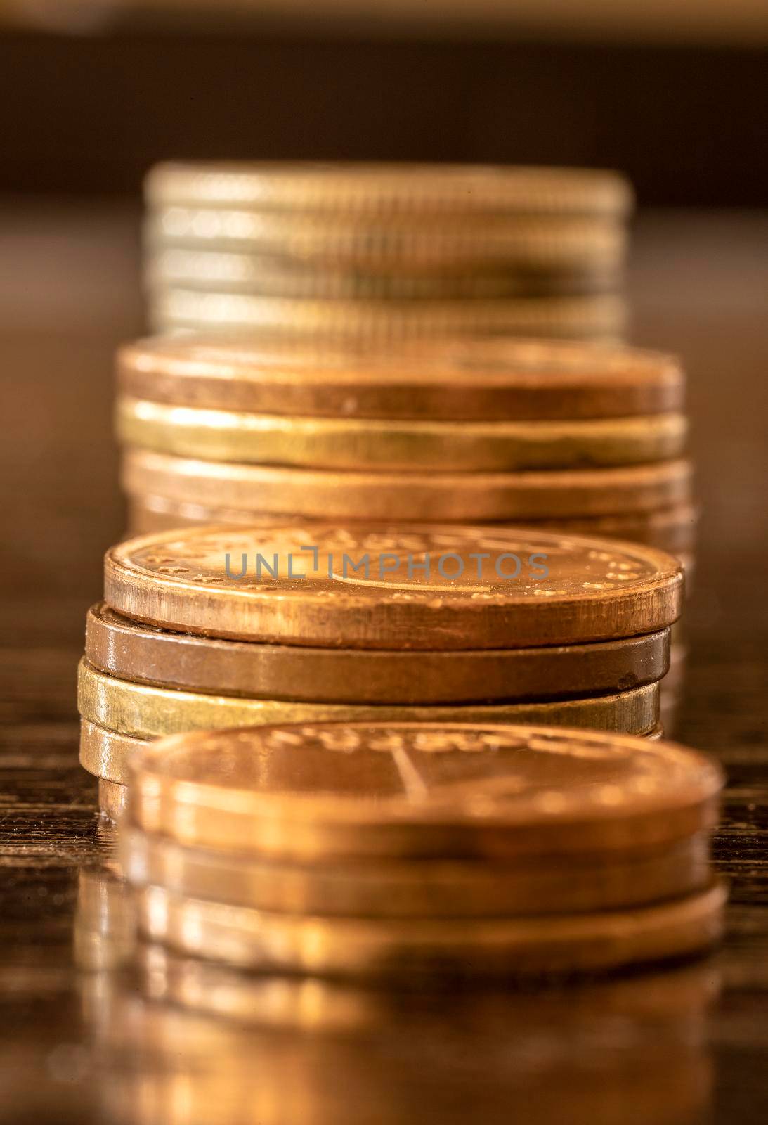 Coins stack in front. Savings money of coins concept for saving or investment for a house, retirement or education. Finance concept.