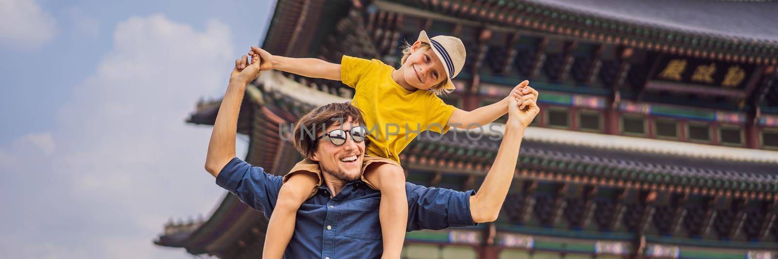 Dad and son tourists Seoul, South Korea. Travel to Korea concept. Traveling with children concept. BANNER, LONG FORMAT