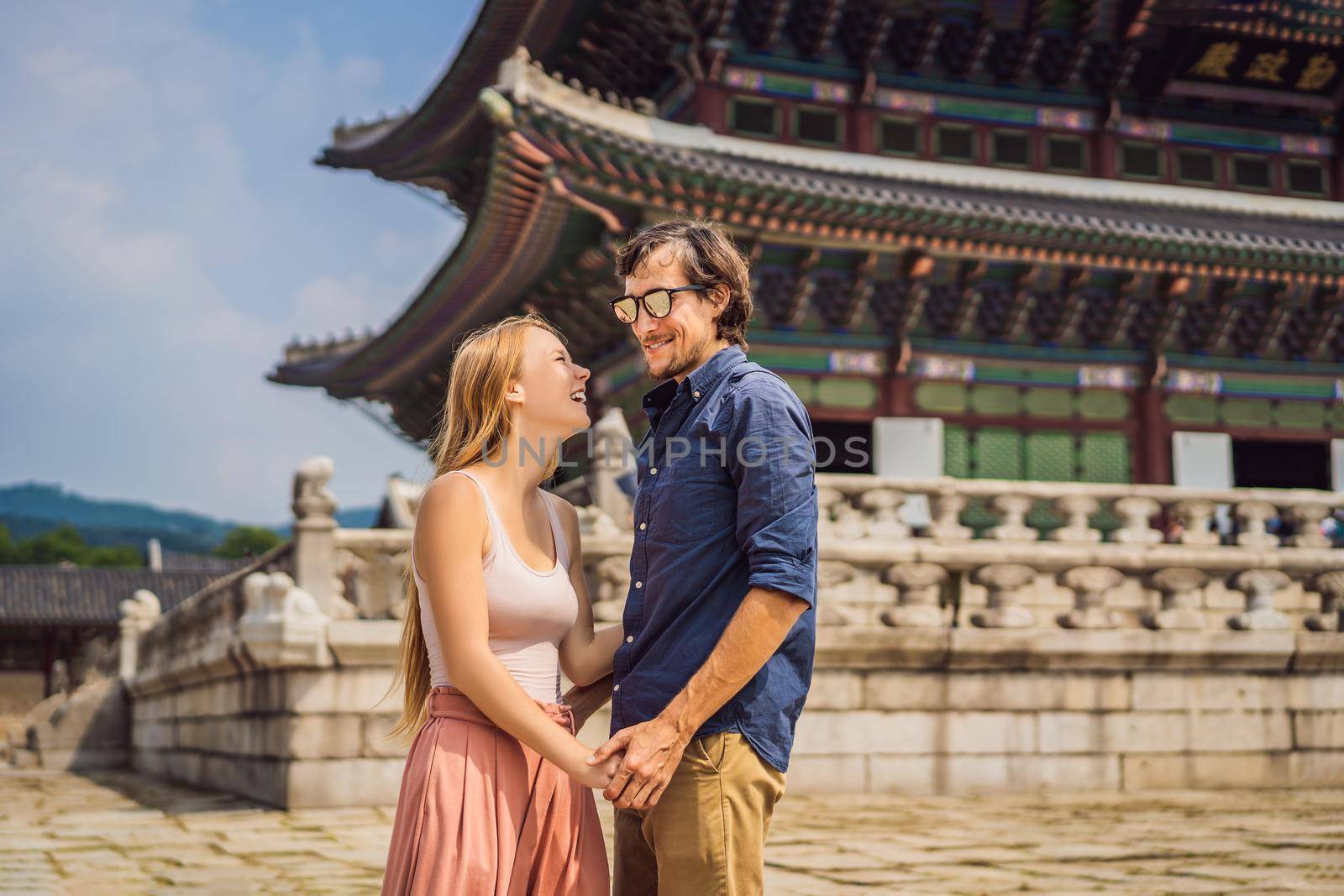 Young couple of spouses, a bride and groom, a husband and wife, boyfriend and girlfriend spend time in Korea. Holidays in Korea. Honeymoon, travel to Korea concept by galitskaya