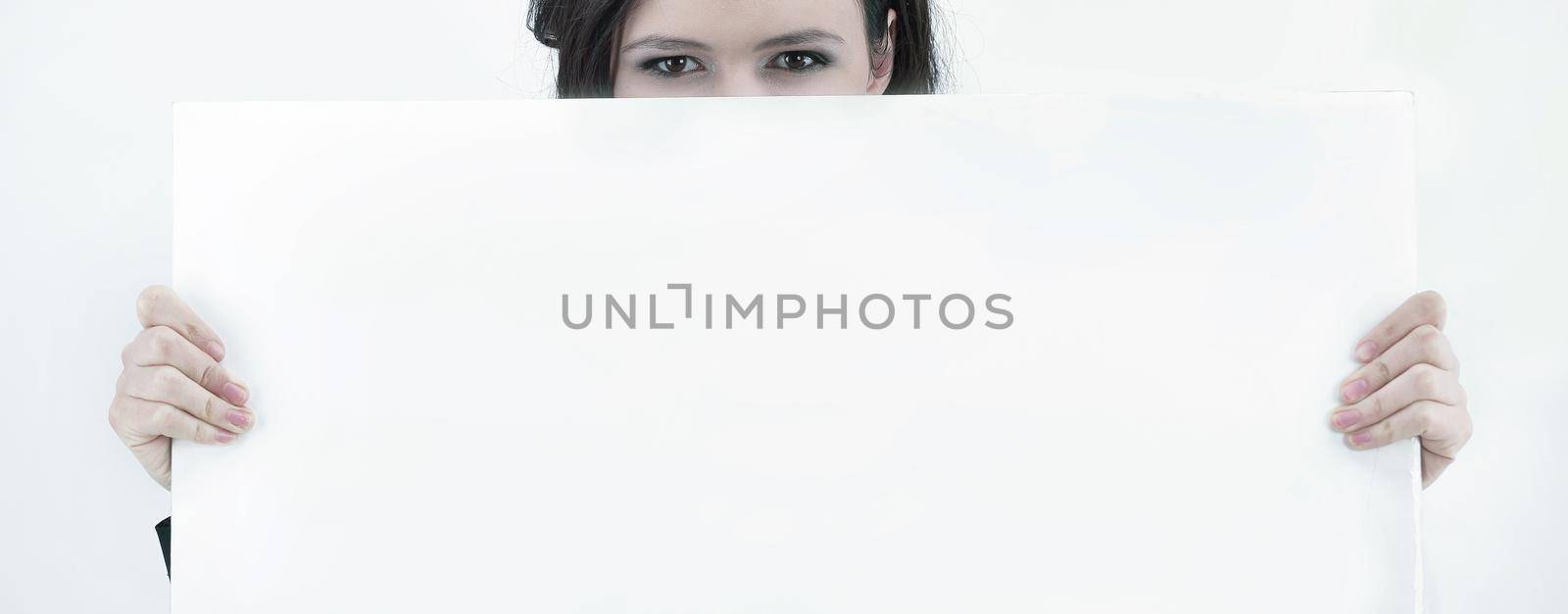 business woman holding a blank banner and showing thumb up.photo with copy space