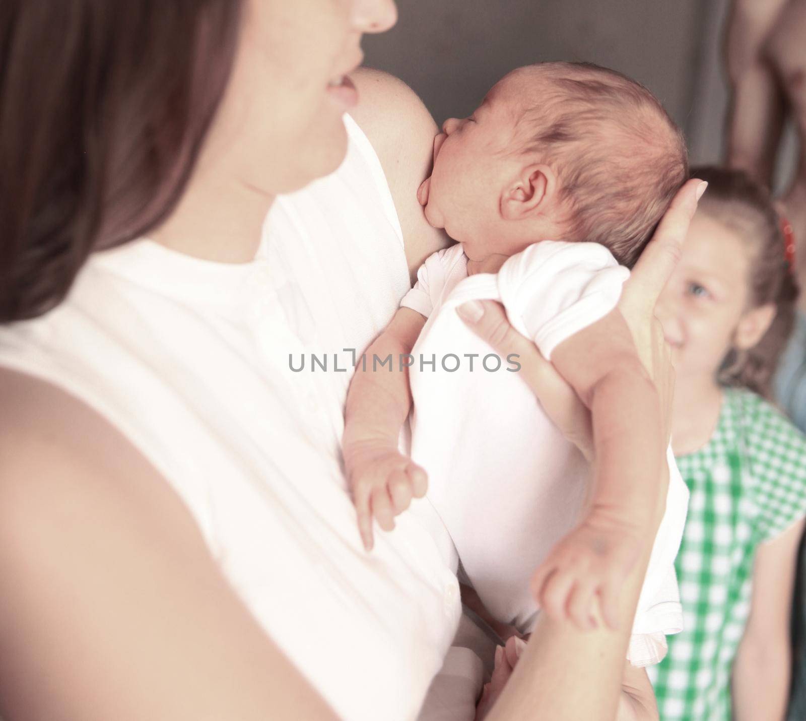 concept of motherhood:a portrait of a young mother with a newbor by SmartPhotoLab