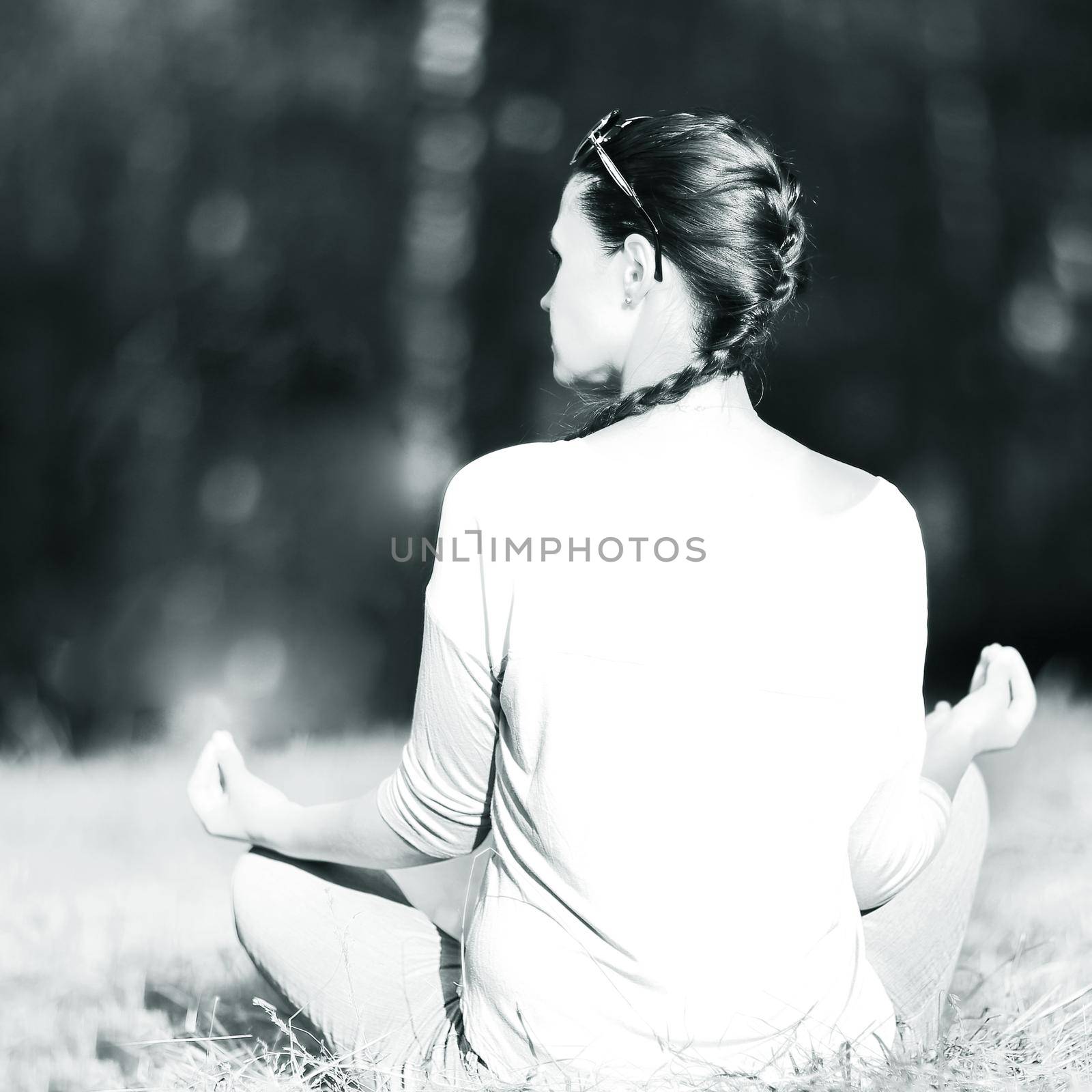 Attractive young woman in Lotus position, black and white photo by SmartPhotoLab
