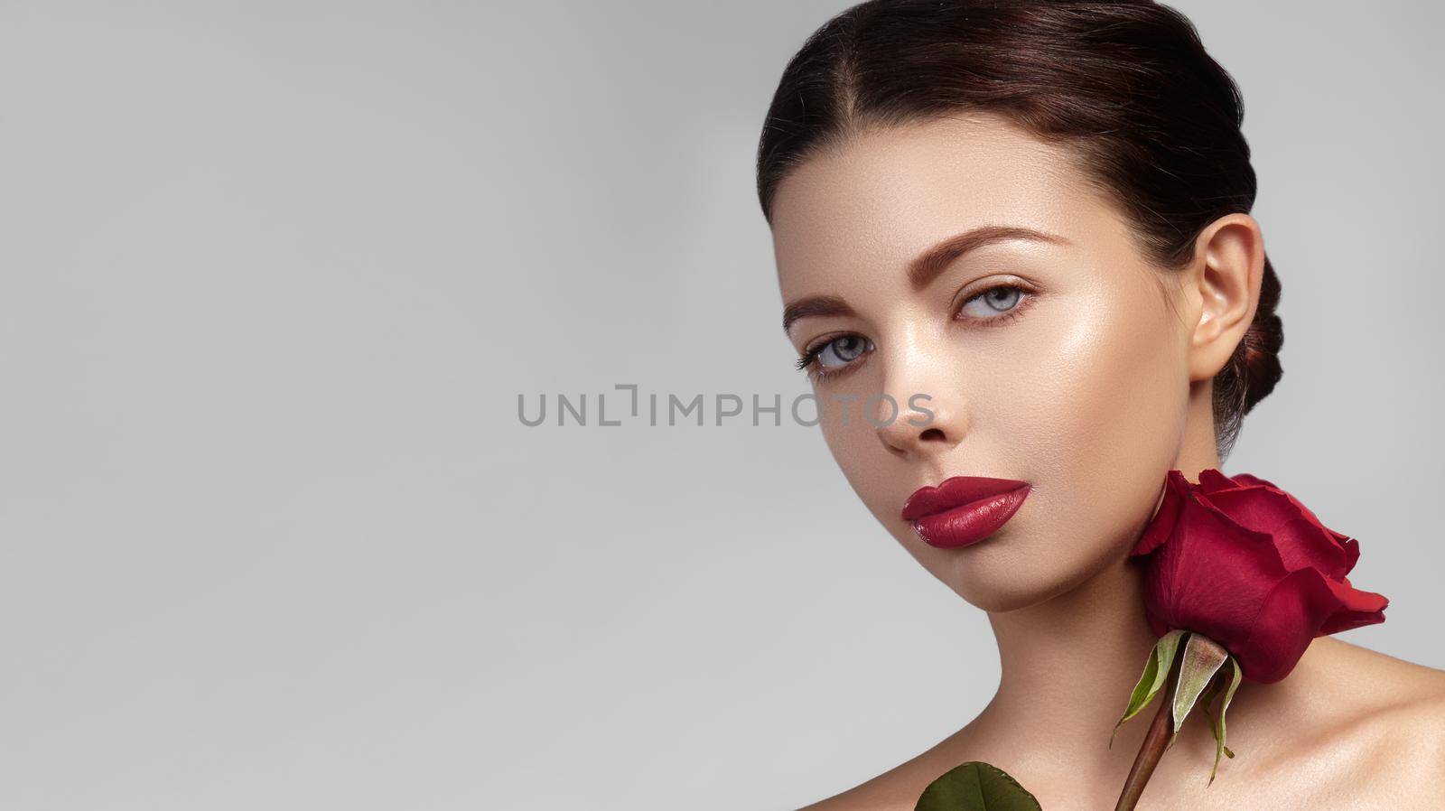 Beautiful woman with bright lipgloss makeup. Perfect clean skin, sexy red lip make-up. Romantic look for Valentines day by MarinaFrost