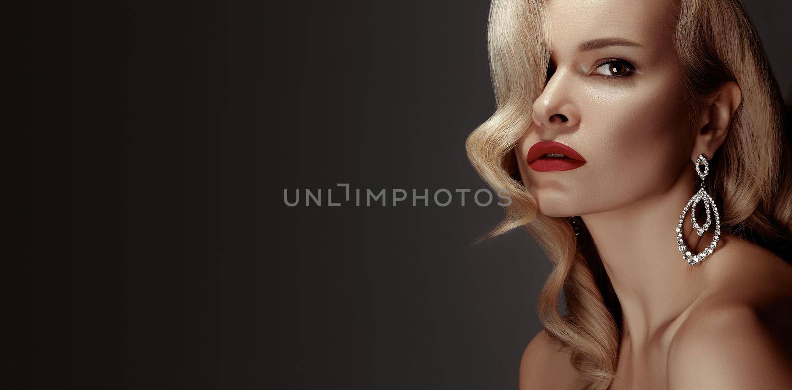 Beautiful Woman with Fashion Make-up and Blond Wave Hairstyle. Glamour American Diva Style with Brilliant Accessories by MarinaFrost